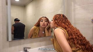 Distracted busty redhead ends up in the men's bathroom and can't resist seeing a big dick