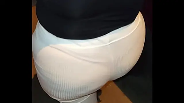 Mature woman wearing red thread in transparent leggings &mdash;  captured on the street