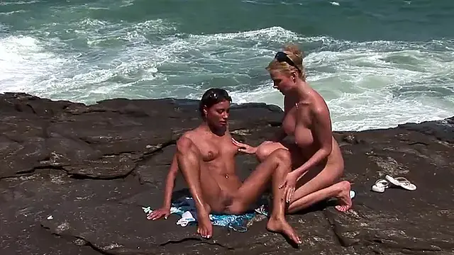 Hot beach babes lick each other's pussy