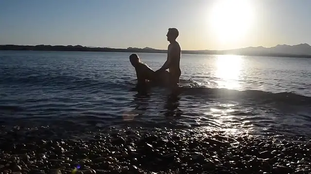 Public babe gets pounded in doggystyle by bigcocked dude on the beach